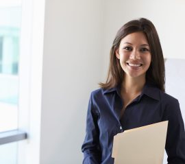 portrait-of-female-doctor-in-exam-room-P3N5DLE-scaled.jpg